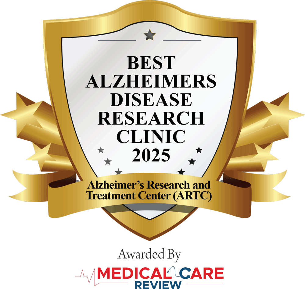 Exterior view of Alzheimer's Research & Treatment Center illuminated at night with a bright blue sign. A news ticker from WPBF 25 News at the bottom mentions a local connection to a new FDA-approved Alzheimer's drug, highlighting advancements in Alzheimer's treatment and research.