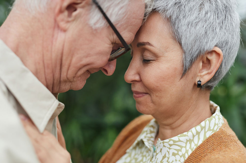 Couple sharing a comforting moment while seeking a complimentary memory assessment for cognitive health concerns